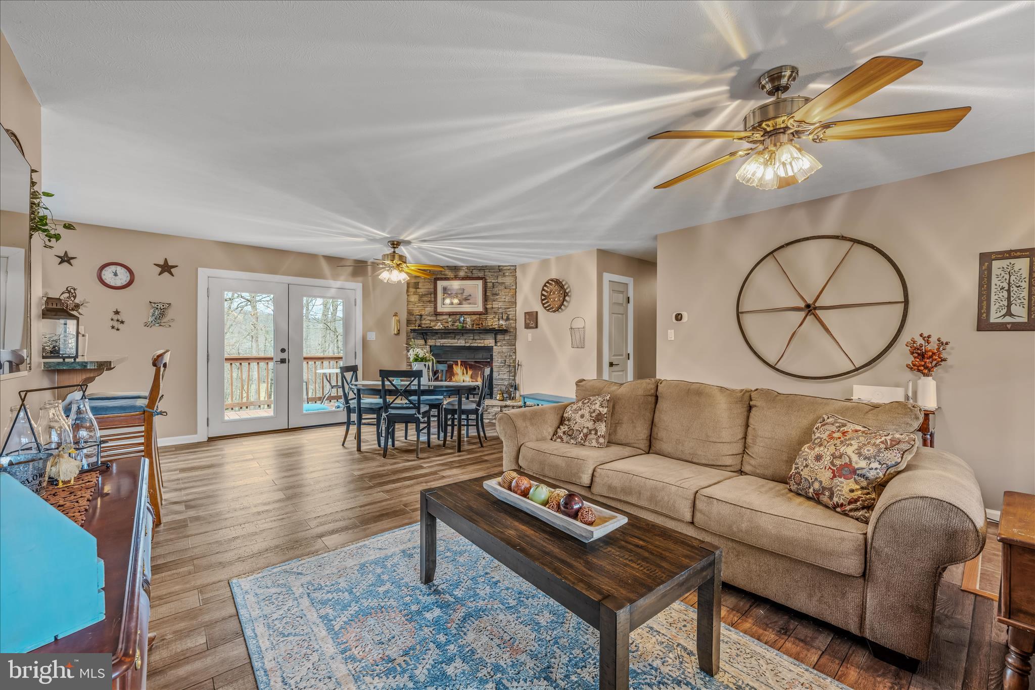 1636 Eckerd Lane Berkeley Springs, WV 25411 - Photo 15 of 85 a living room with furniture a chandelier and a large window