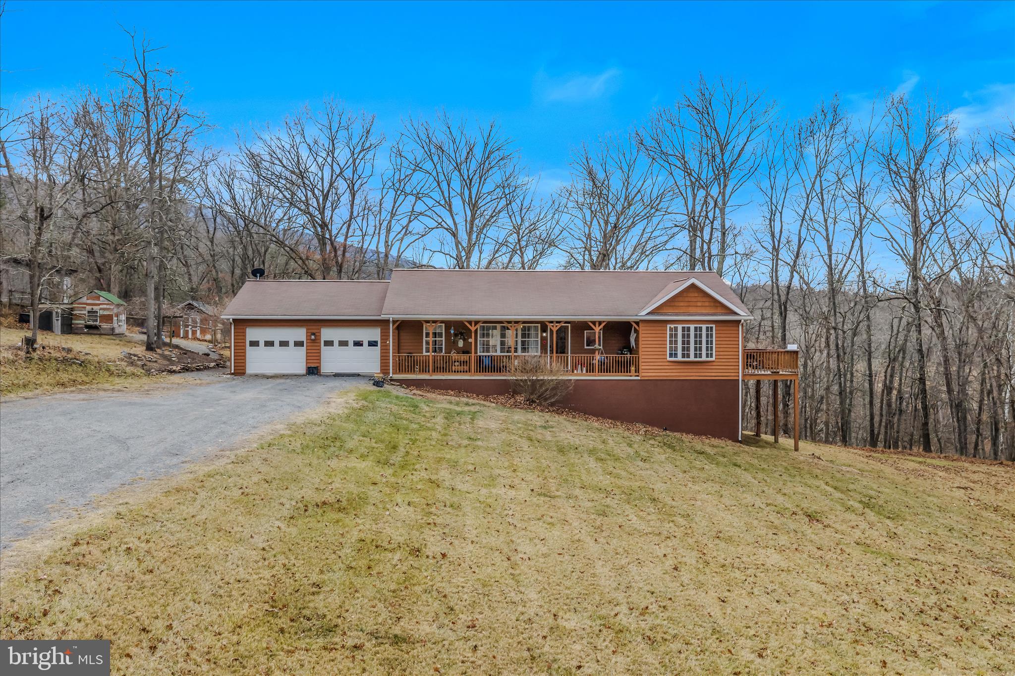1636 Eckerd Lane Berkeley Springs, WV 25411 - Photo 2 of 85 a front view of a house with a yard and garage