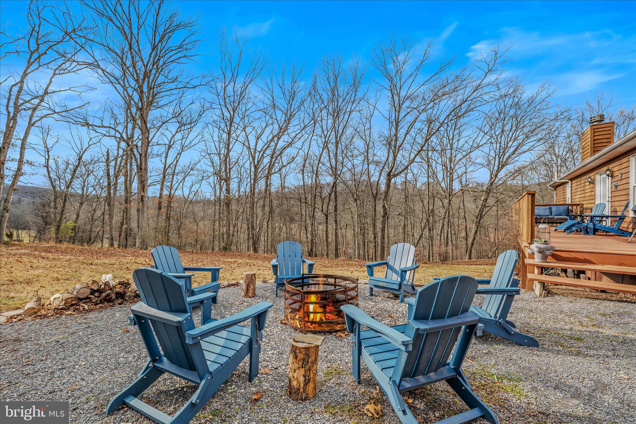 1636 Eckerd Lane Berkeley Springs, WV 25411 - Photo 27 of 85 a backyard of a house with table and chairs