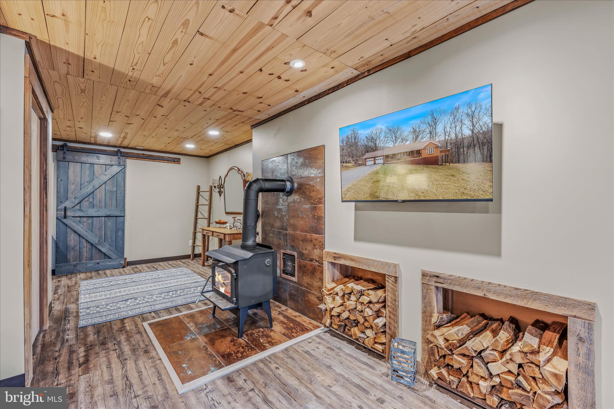 1636 Eckerd Lane Berkeley Springs, WV 25411 - Photo 47 of 85 a view of a livingroom with furniture wooden floor and a rug