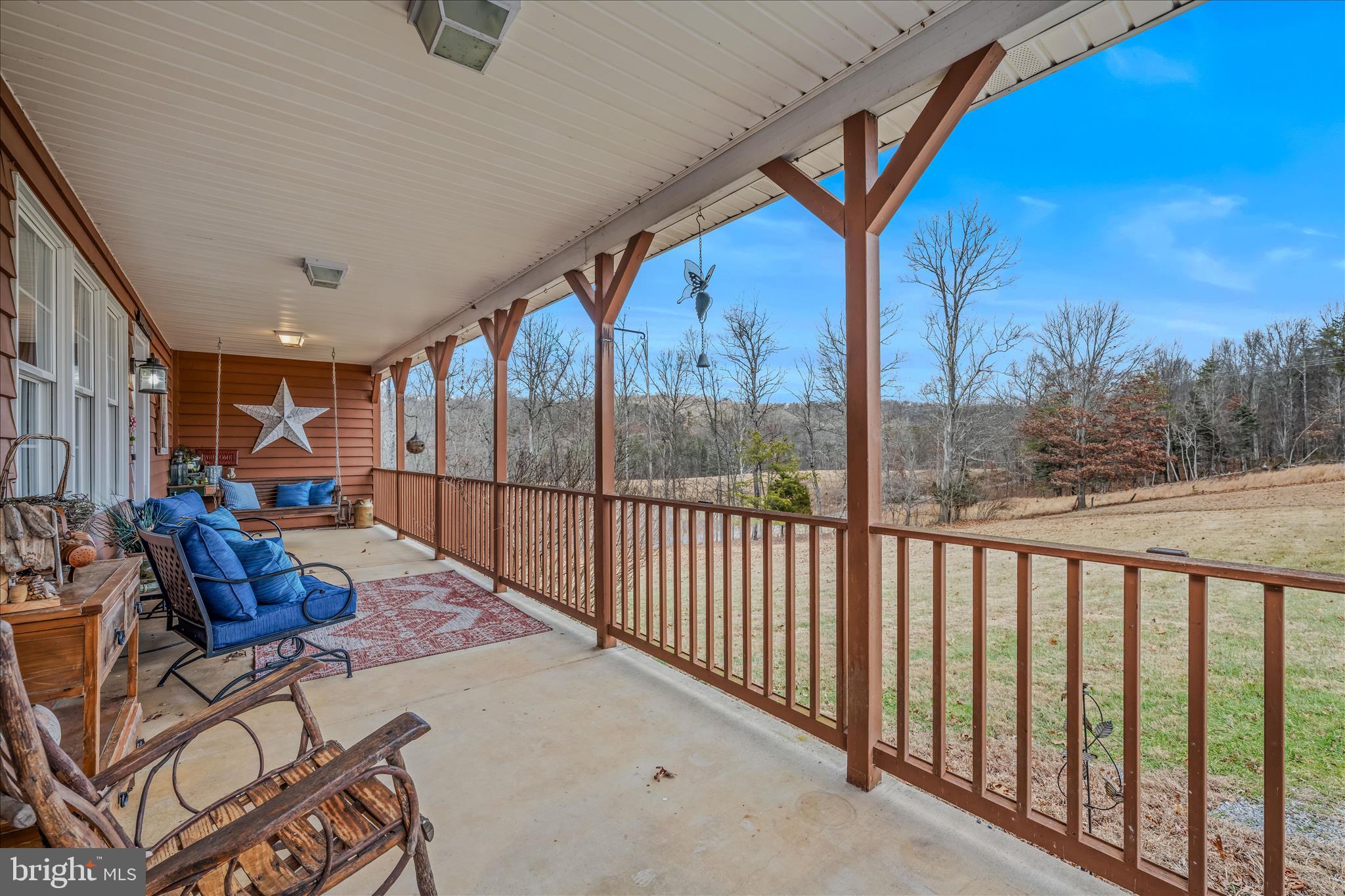 1636 Eckerd Lane Berkeley Springs, WV 25411 - Photo 7 of 85 a view of a porch with furniture