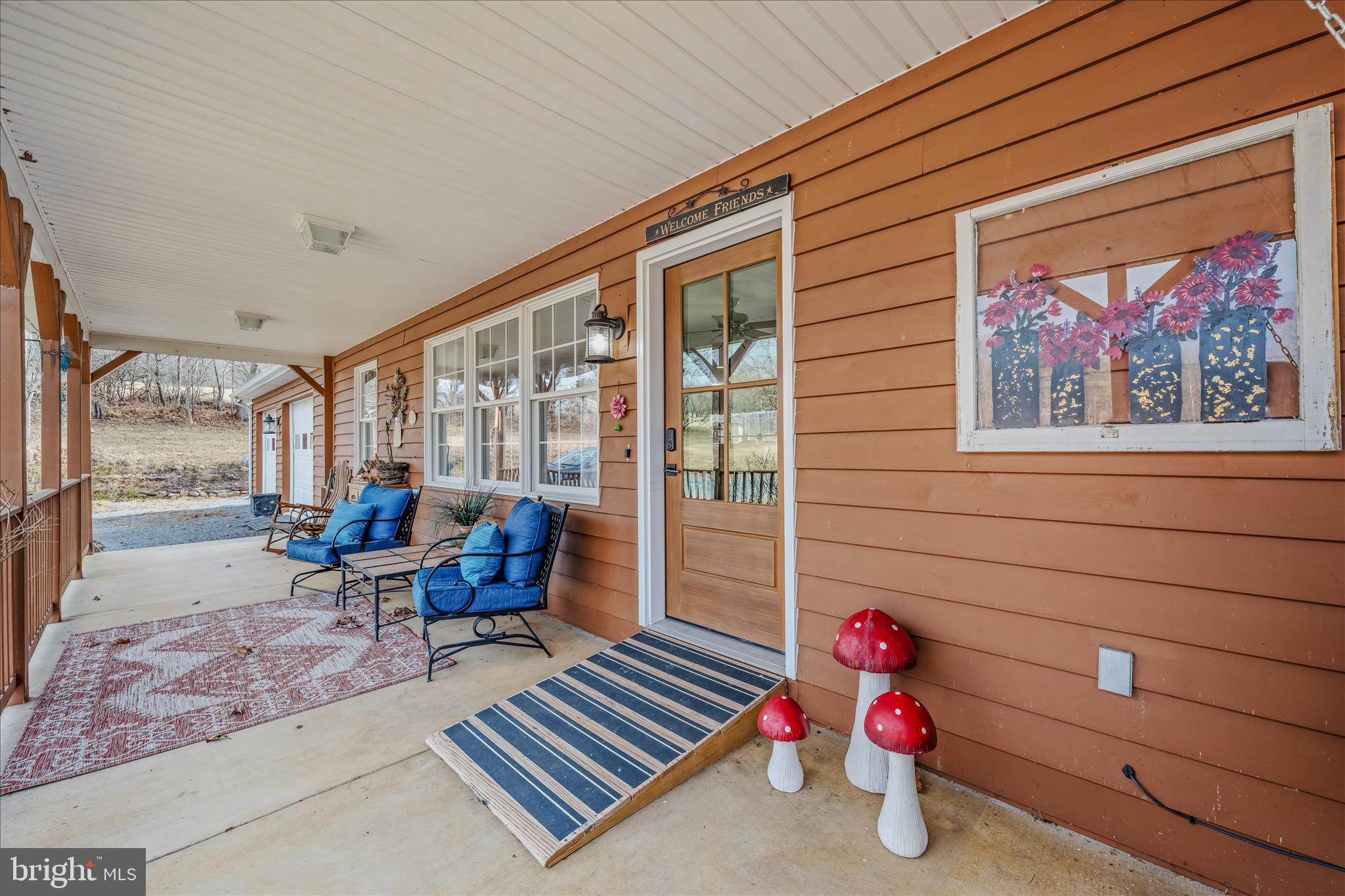 1636 Eckerd Lane Berkeley Springs, WV 25411 - Photo 10 of 85 a living room with furniture and a gate