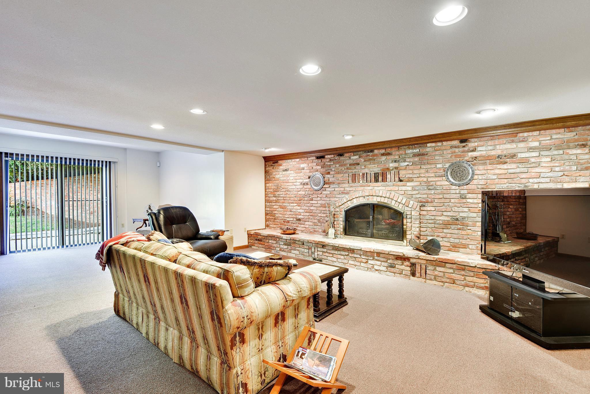 17 Bryants Nursery Road Silver Spring, MD 20905 - Photo 7 of 30 Rec room w/ custom fireplace/ level walk-out