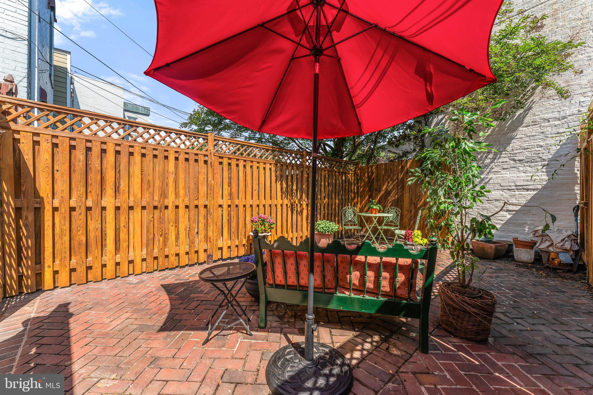 328 A Street Northeast Washington, DC 20002 - Photo 18 of 19 a view of a chairs and table under an umbrella in patio