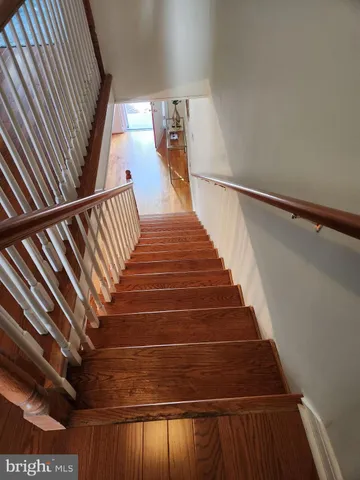 a living room with furniture and a mirror