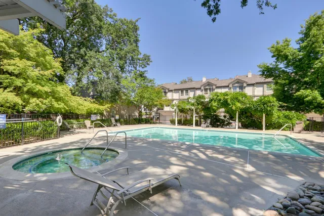 a view of a backyard with sitting area