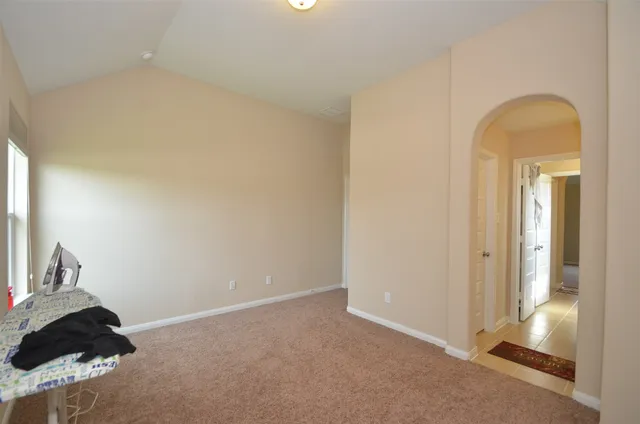 a view of a bathroom from a hallway
