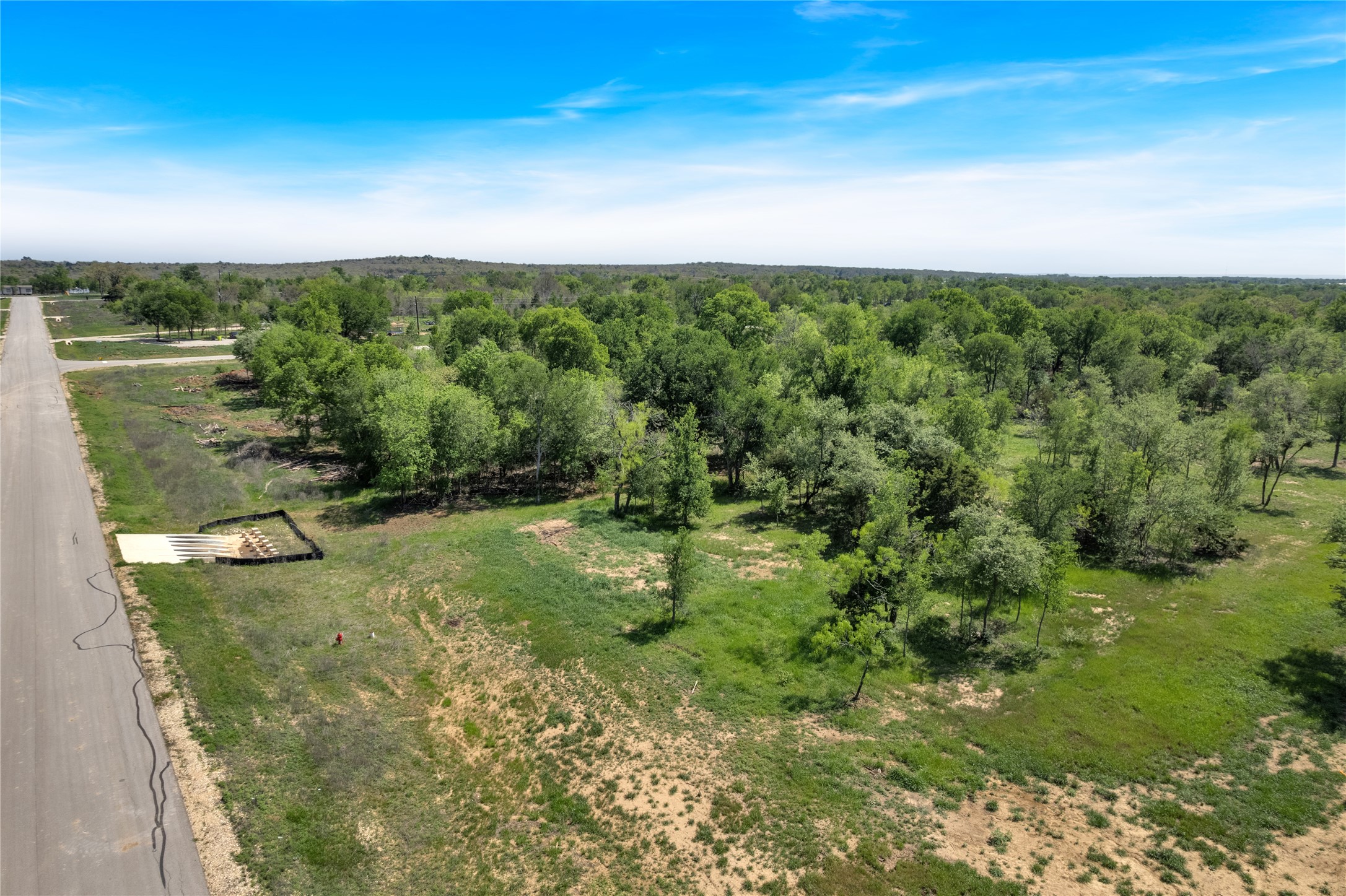 114 Empire Street Elgin, TX 78621 - Photo 31 of 36 Drone / aerial view with a rural view and a forest view