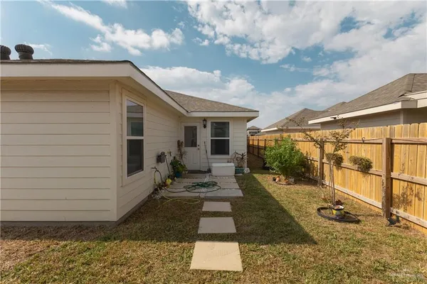 a view of a back yard of the house