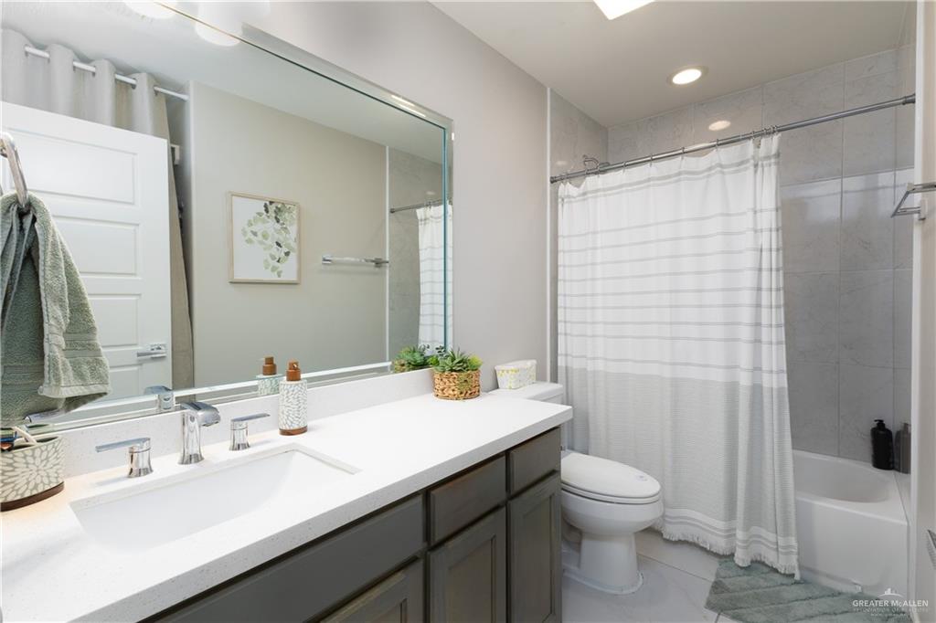 2201 North 26th Drive Hidalgo, TX 78557 - Photo 10 of 12 a bathroom with a sink a toilet and shower