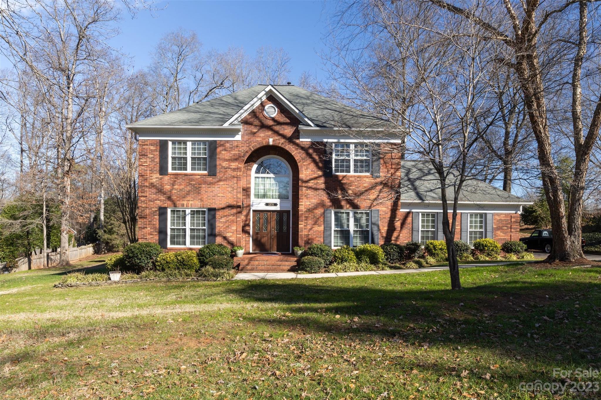 1378 Braeburn Road Northwest Concord, NC 28027 - Photo 1 of 36 a front view of a house with garden