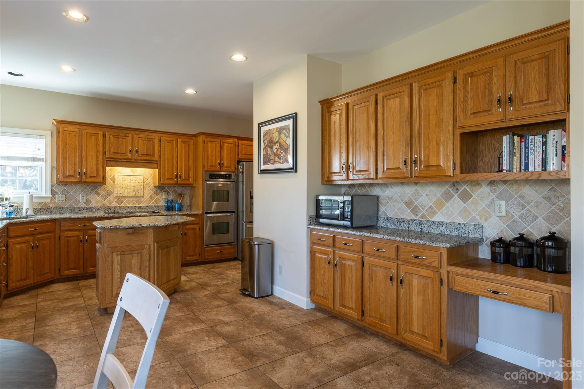 1378 Braeburn Road Northwest Concord, NC 28027 - Photo 13 of 36 a kitchen with refrigerator cabinets and stove top oven