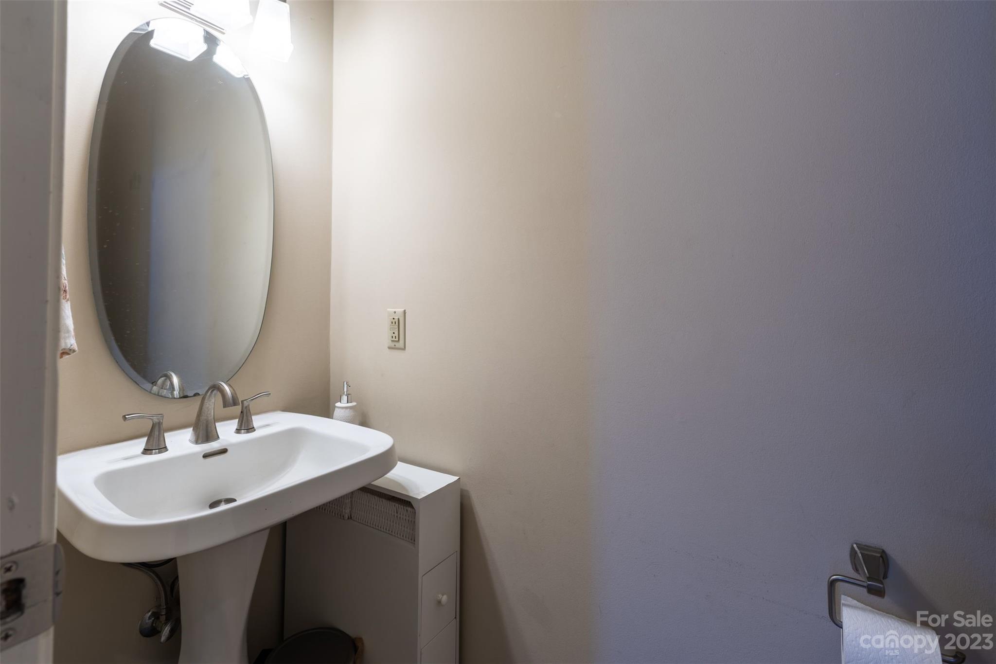1378 Braeburn Road Northwest Concord, NC 28027 - Photo 20 of 36 a bathroom with a sink and a mirror