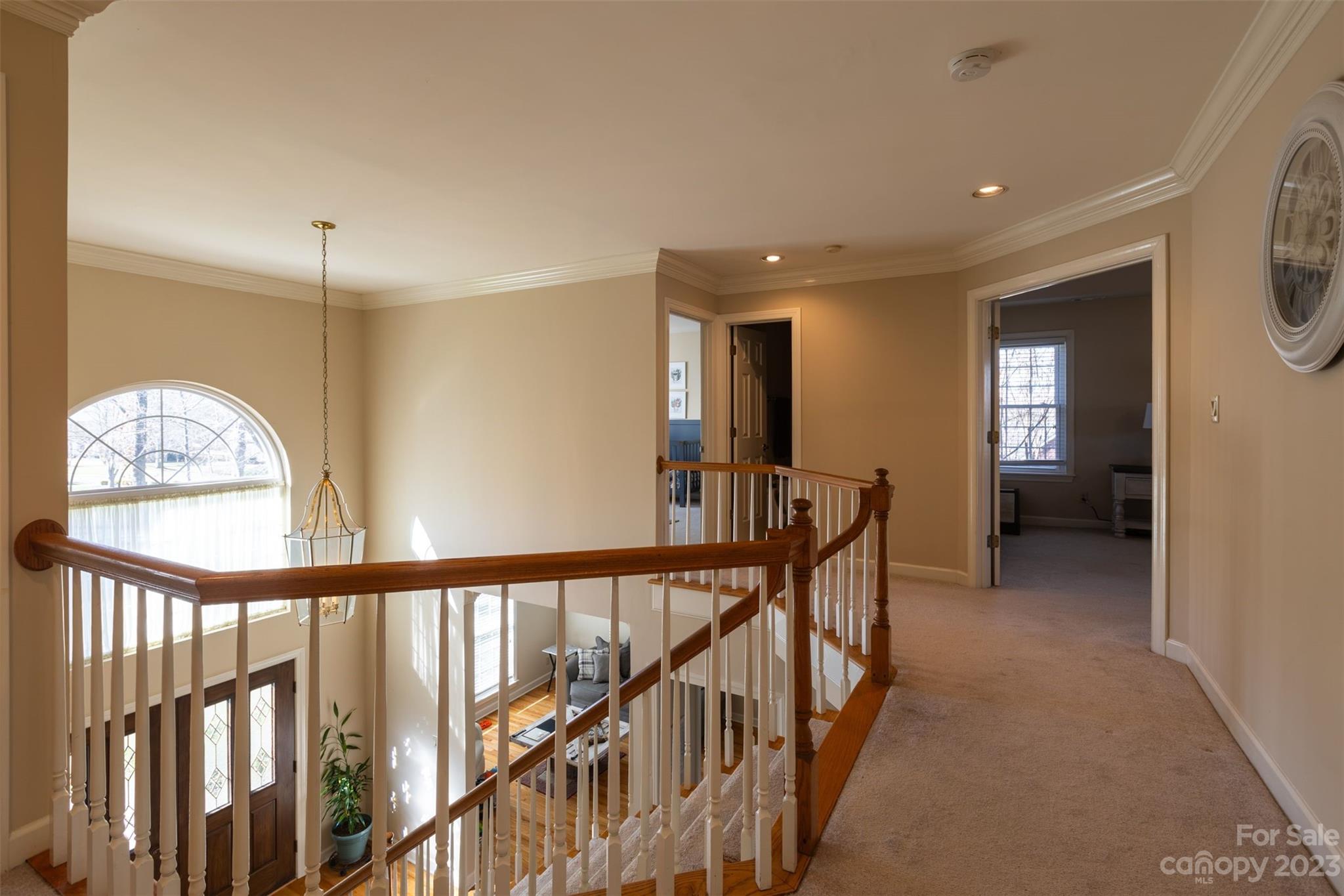 1378 Braeburn Road Northwest Concord, NC 28027 - Photo 21 of 36 a view of a hallway view with floor to ceiling window and stairs