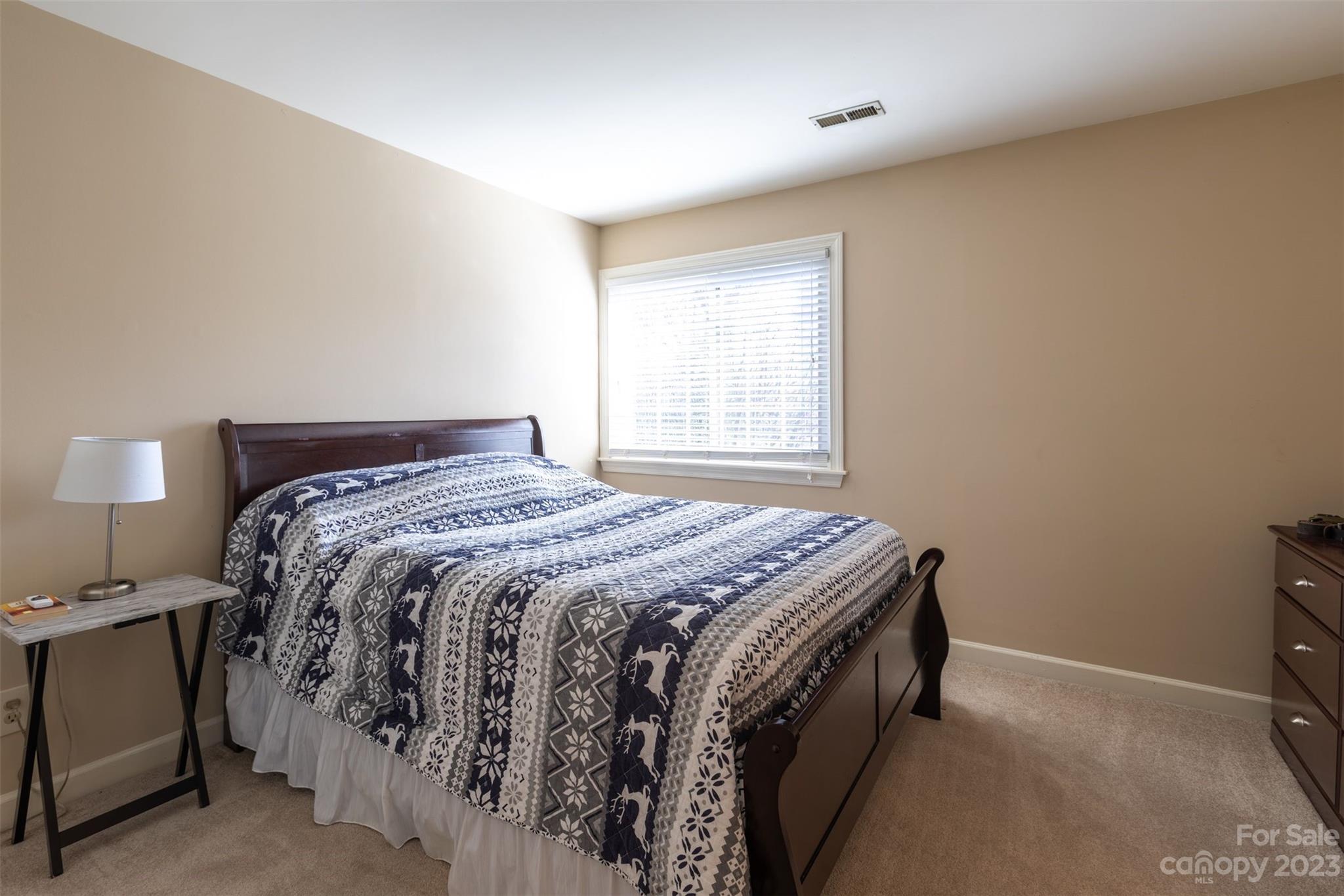 1378 Braeburn Road Northwest Concord, NC 28027 - Photo 28 of 36 a bedroom with a bed and a window