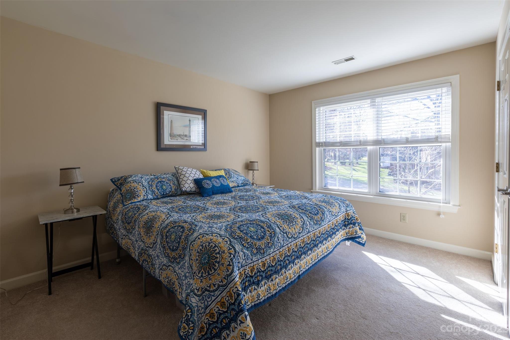 1378 Braeburn Road Northwest Concord, NC 28027 - Photo 29 of 36 a bed sitting in a bedroom next to a window