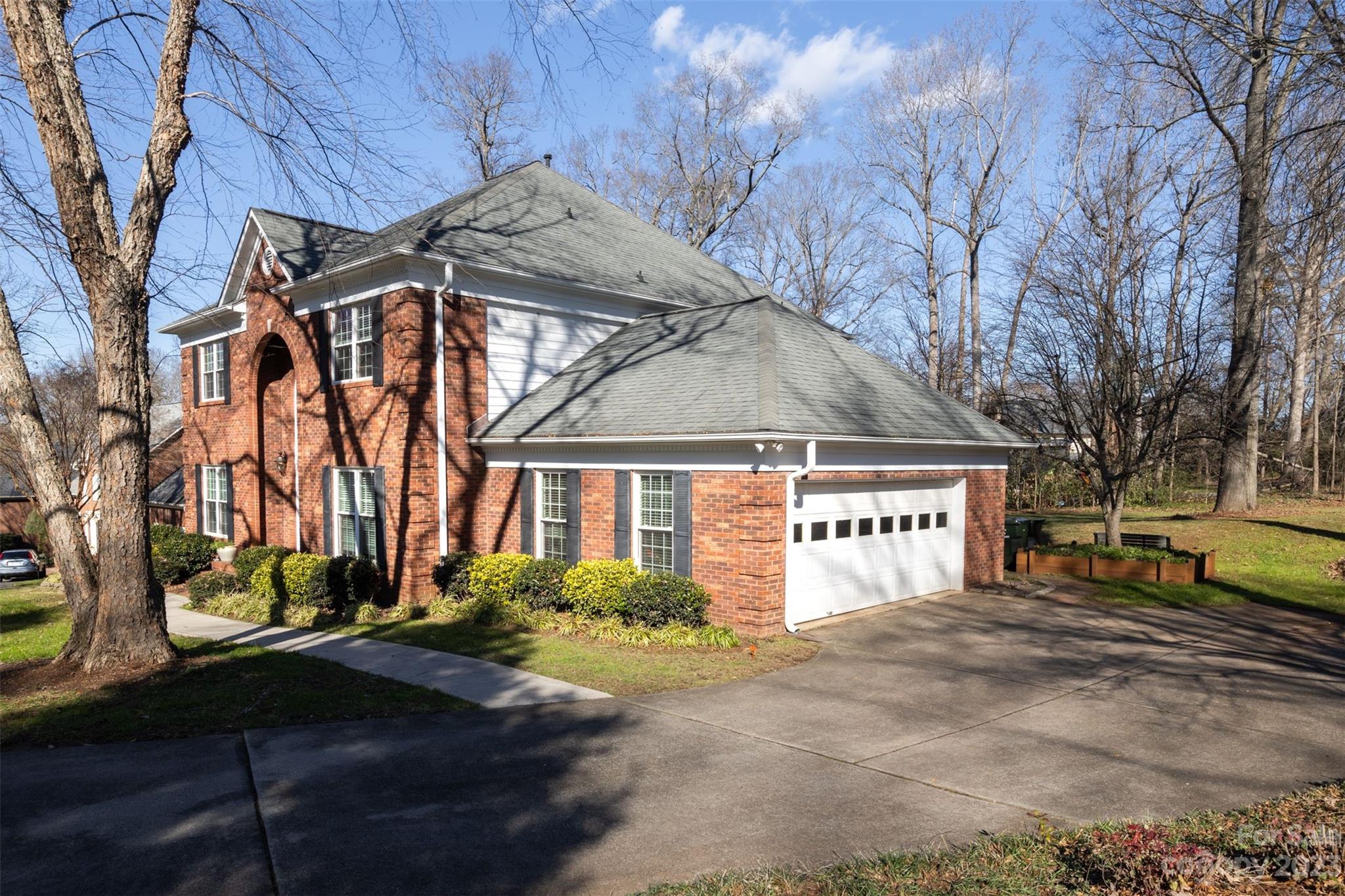 1378 Braeburn Road Northwest Concord, NC 28027 - Photo 3 of 36 a front view of a house with a yard