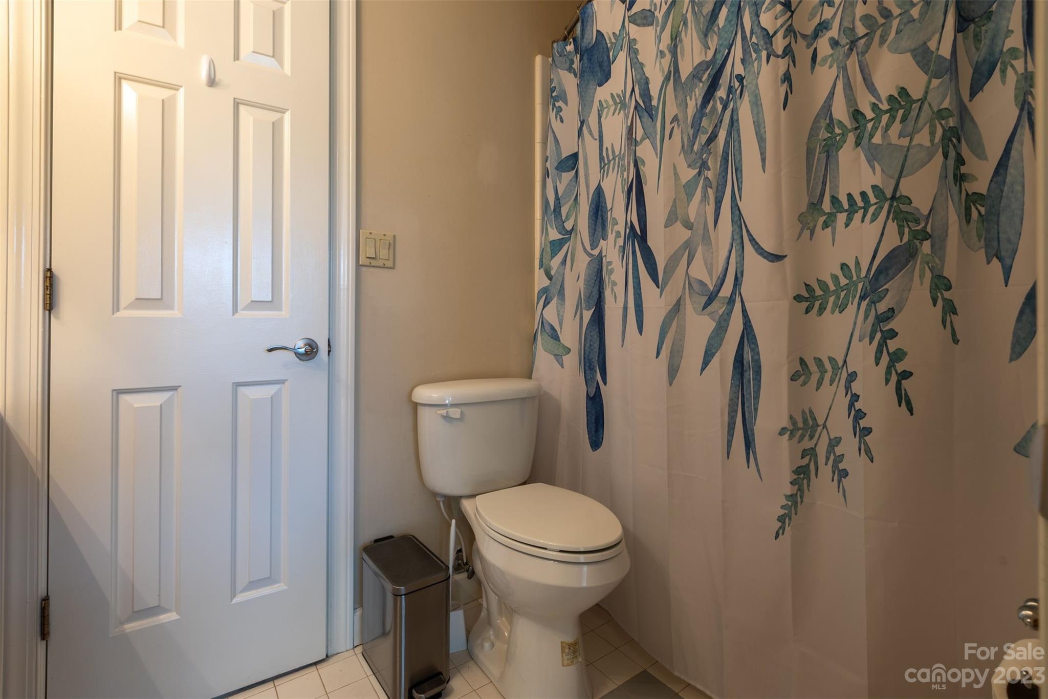 1378 Braeburn Road Northwest Concord, NC 28027 - Photo 31 of 36 a white toilet sitting next to a shower curtain