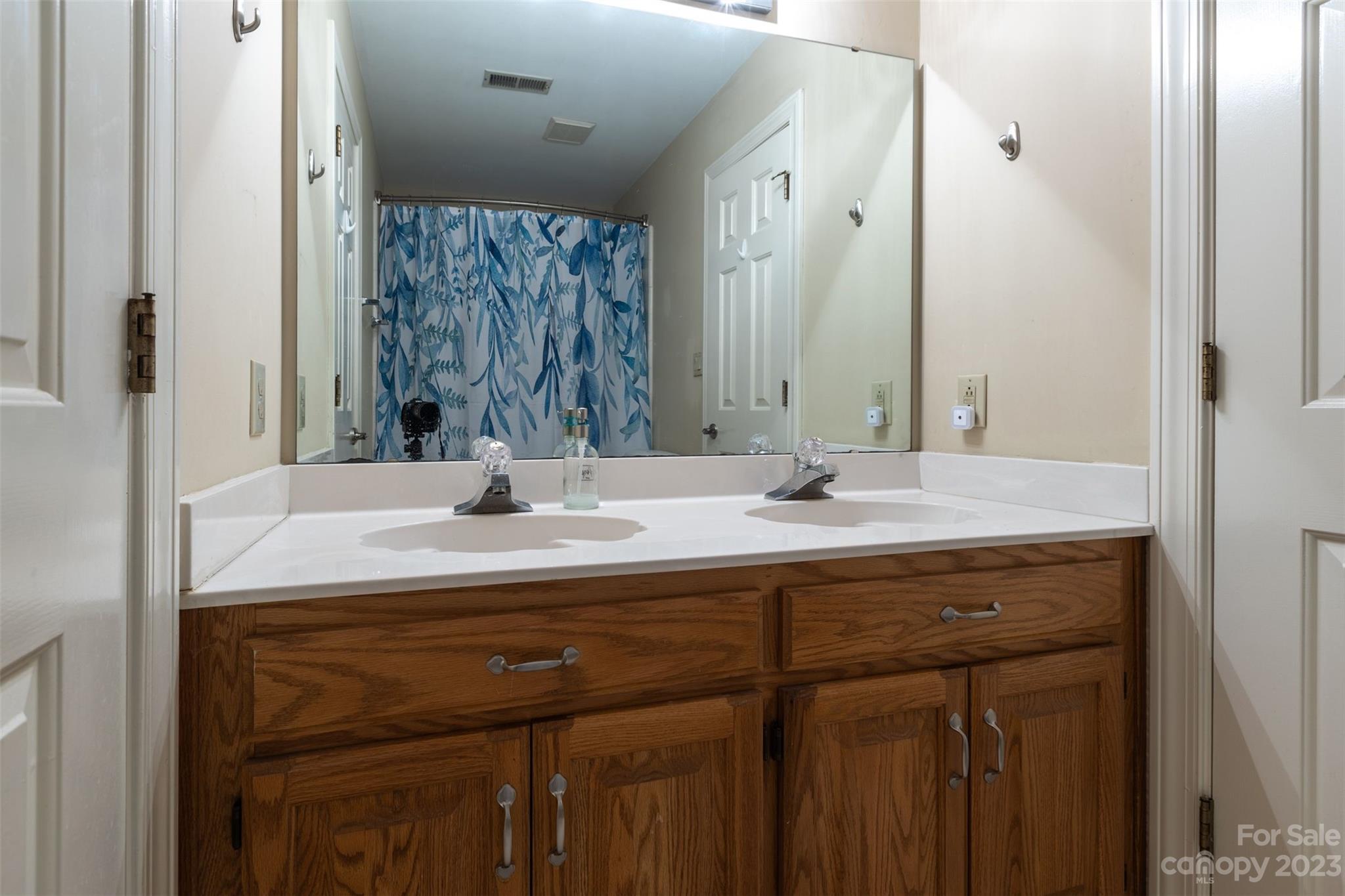 1378 Braeburn Road Northwest Concord, NC 28027 - Photo 32 of 36 a bathroom with a sink double vanity and a mirror