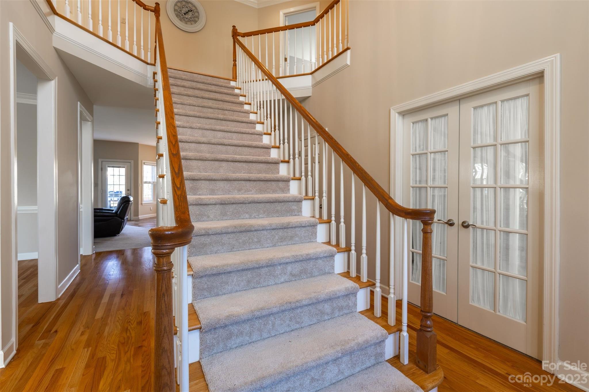 1378 Braeburn Road Northwest Concord, NC 28027 - Photo 4 of 36 a view of staircase with wooden floor and a view of bathroom