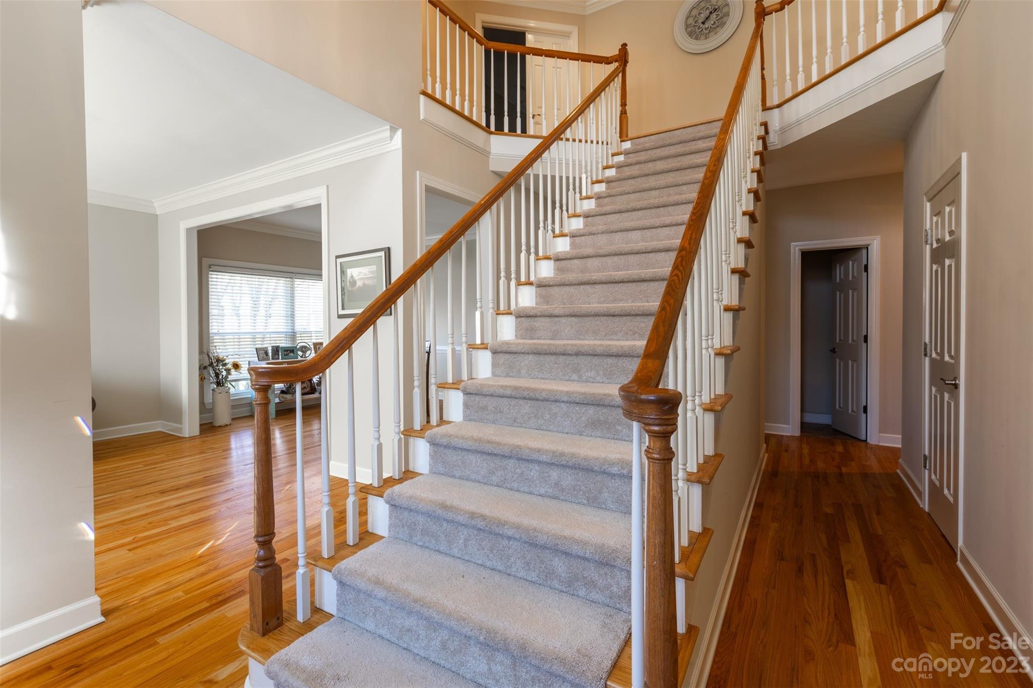 1378 Braeburn Road Northwest Concord, NC 28027 - Photo 5 of 36 a view of staircase with wooden floor and a rug