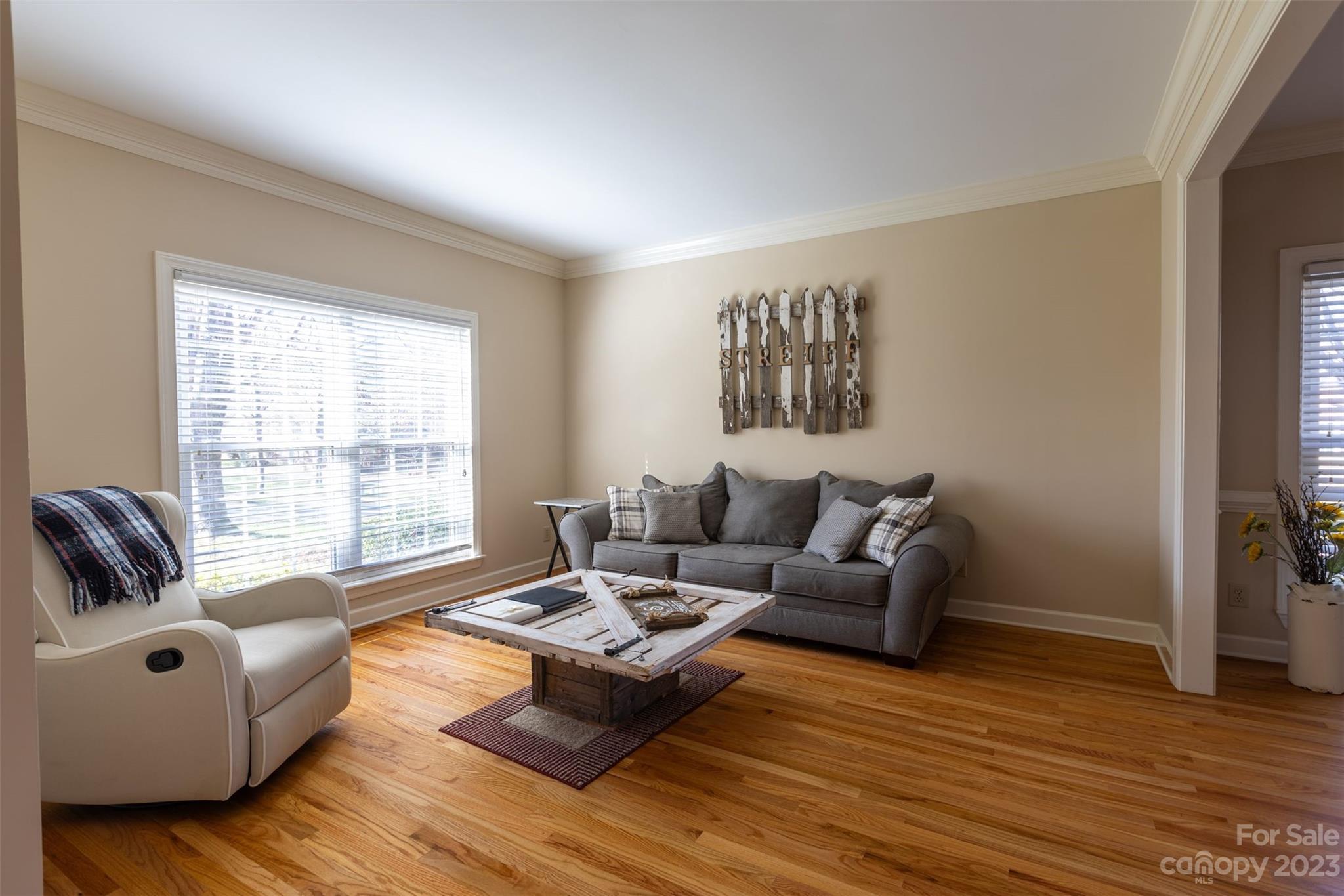 1378 Braeburn Road Northwest Concord, NC 28027 - Photo 7 of 36 a living room with furniture and a window