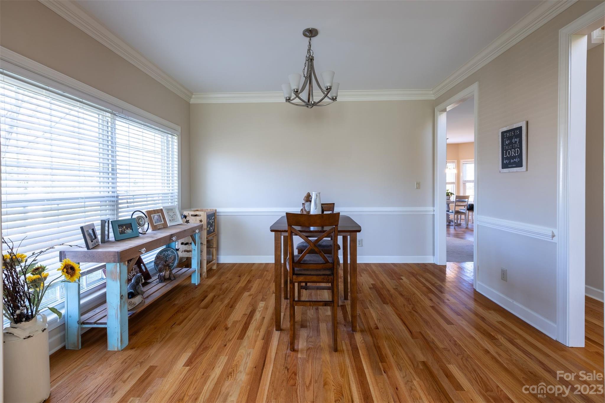 1378 Braeburn Road Northwest Concord, NC 28027 - Photo 9 of 36 a view of a dining room with furniture window and wooden floor