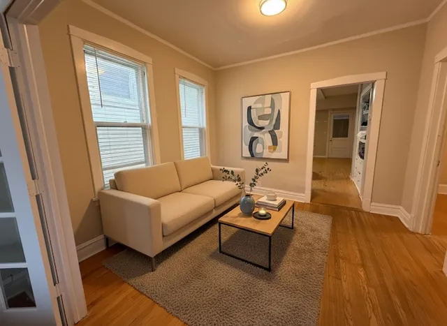 a living room with furniture and a window