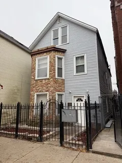 a front view of a house with glass windows