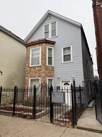 a front view of a house with glass windows