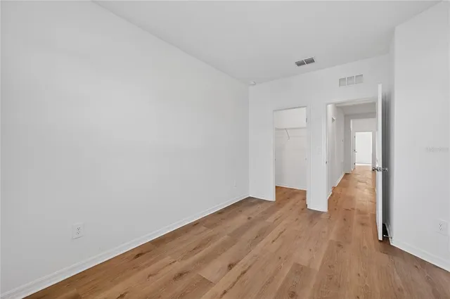a view of wooden floor in an empty room