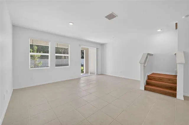 a view of empty room with windows