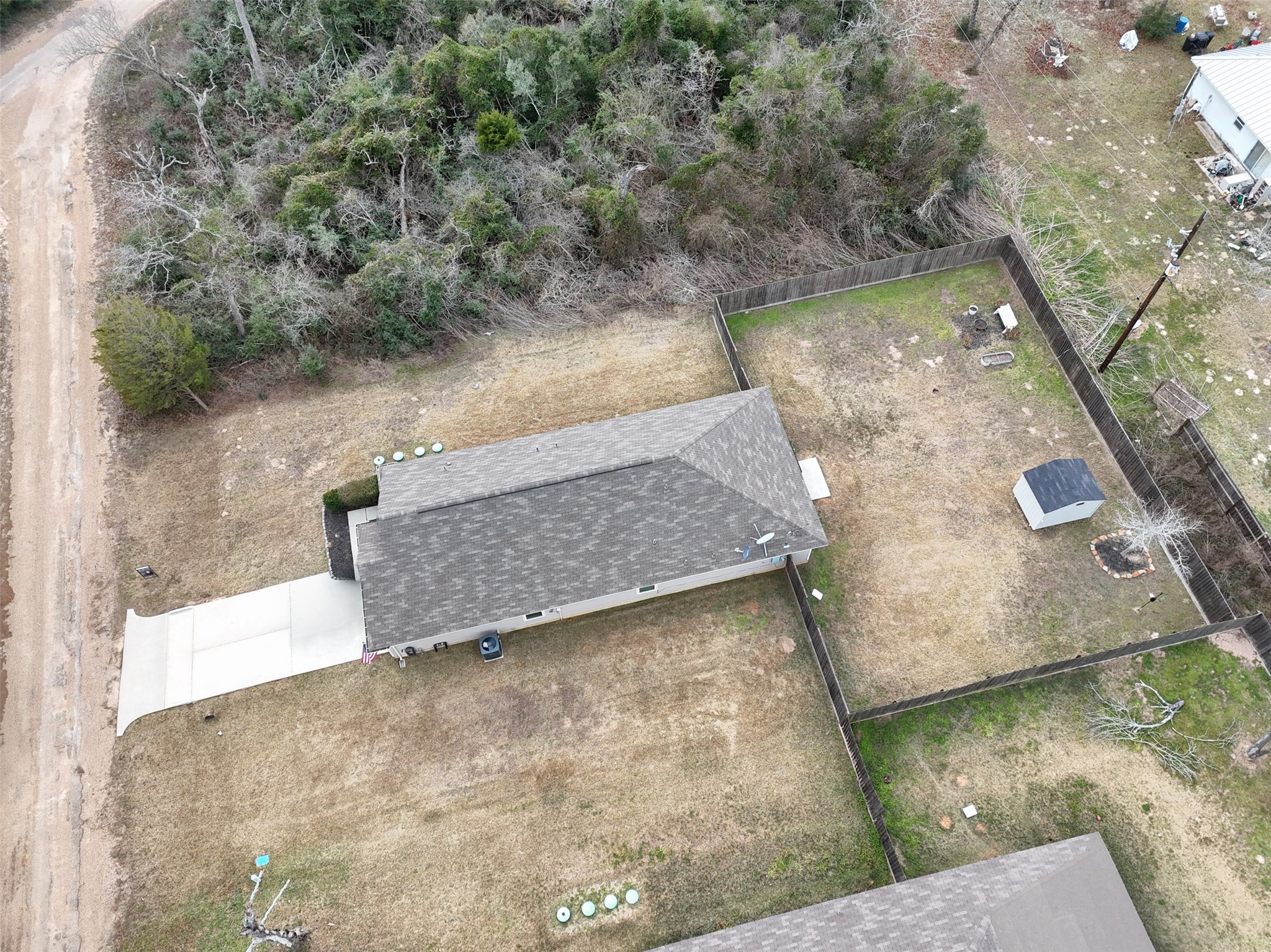 26431 Pin Oak Drive Hempstead, TX 77445 - Photo 28 of 32 Overhead view highlighting the fenced yard footprint, storage shed placement, and overall lot layout.