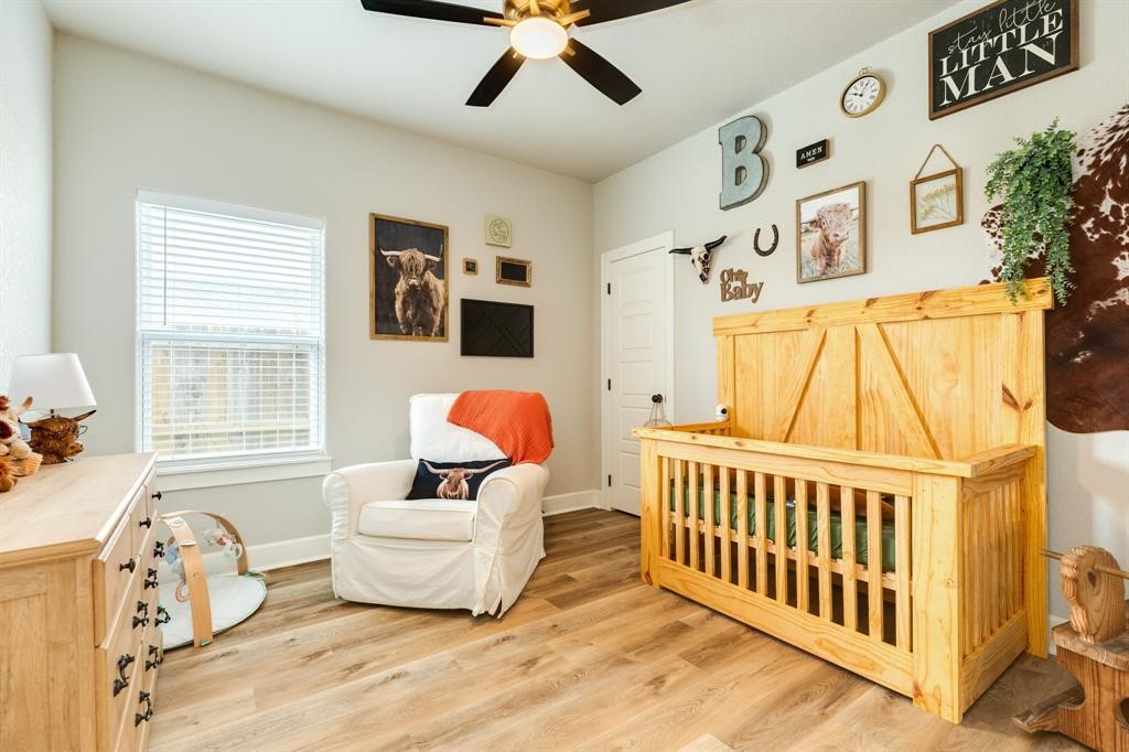 628 Greystone Lane Angleton, TX 77515 - Photo 27 of 33 a bedroom with furniture and windows