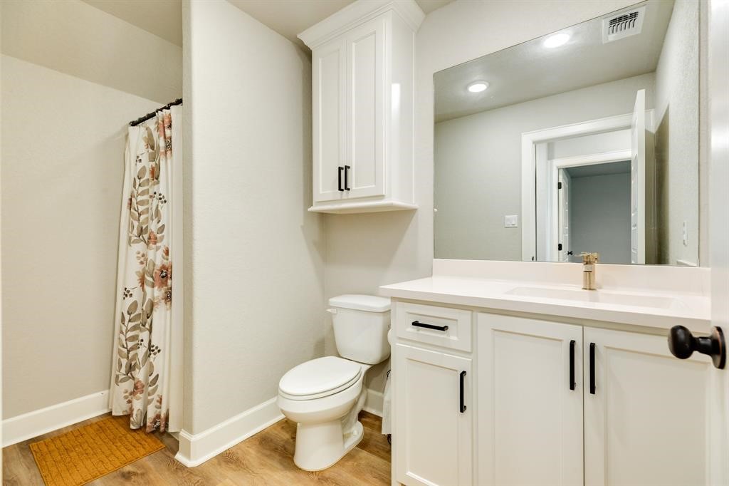 628 Greystone Lane Angleton, TX 77515 - Photo 29 of 33 a bathroom with a sink a toilet and shower