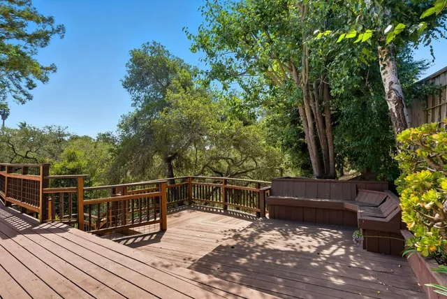 a view of balcony with wooden floor and outdoor seating