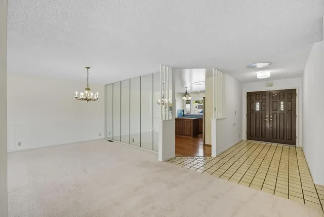 a view of a hallway with a bathroom