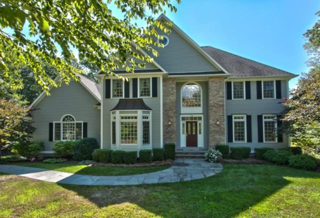 70 Riding Ridge Road Monroe, CT 06468 - Photo 1 of 1 a front view of a house with a yard