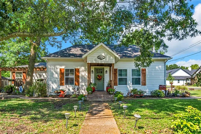 front view of a house with a garden