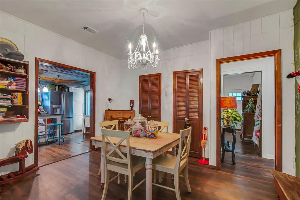 182 Douglas Street Van Alstyne, TX 75495 - Photo 17 of 23 a view of a dining room with furniture window and wooden floor