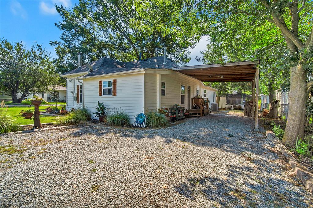 182 Douglas Street Van Alstyne, TX 75495 - Photo 20 of 23 a view of a house with a yard
