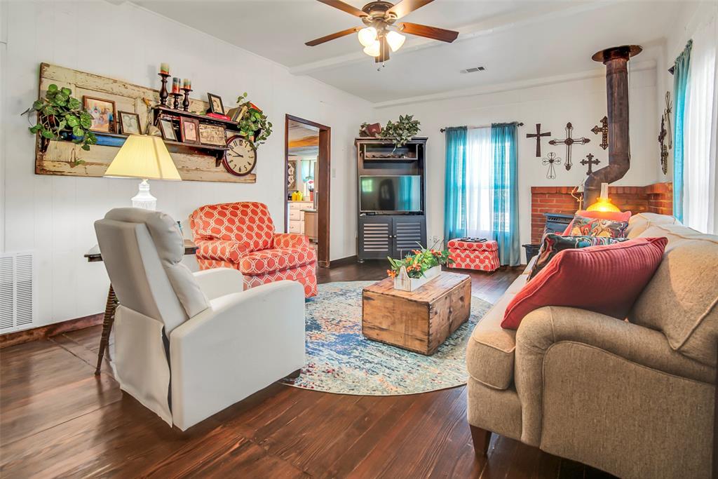 182 Douglas Street Van Alstyne, TX 75495 - Photo 5 of 23 a living room with furniture and wooden floor