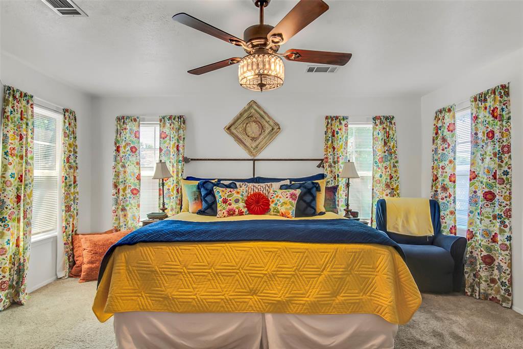 182 Douglas Street Van Alstyne, TX 75495 - Photo 8 of 23 a bedroom with a bed and window