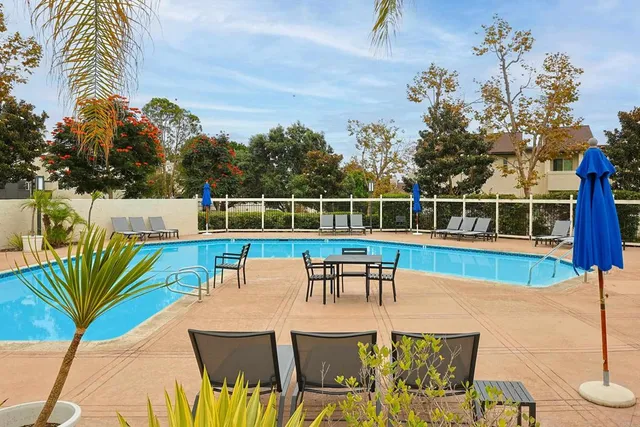 a view of a chairs and table in patio