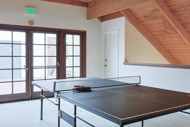 a view of a living room and kitchen