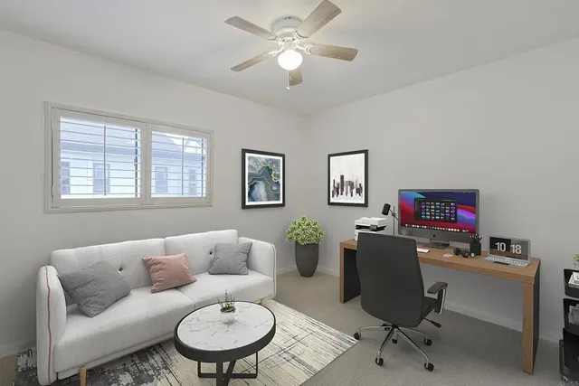 a work room with furniture and a window