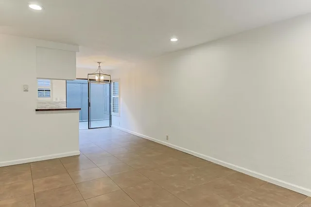 a view of a kitchen with a refrigerator a cabinet and a refrigerator