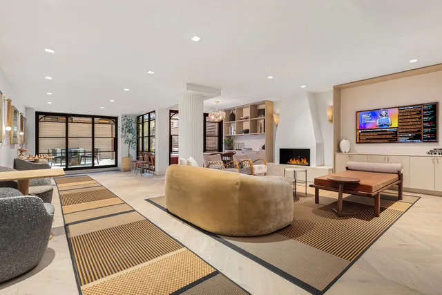 a living room with fireplace furniture and a flat screen tv