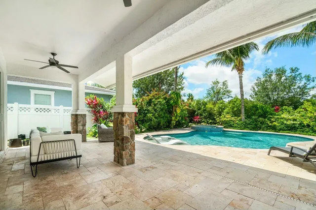 a view of a porch with furniture and garden