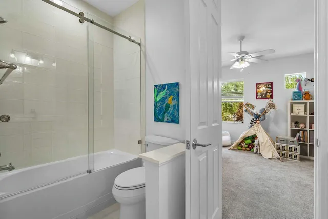 a view of a bathroom with a tub and shower